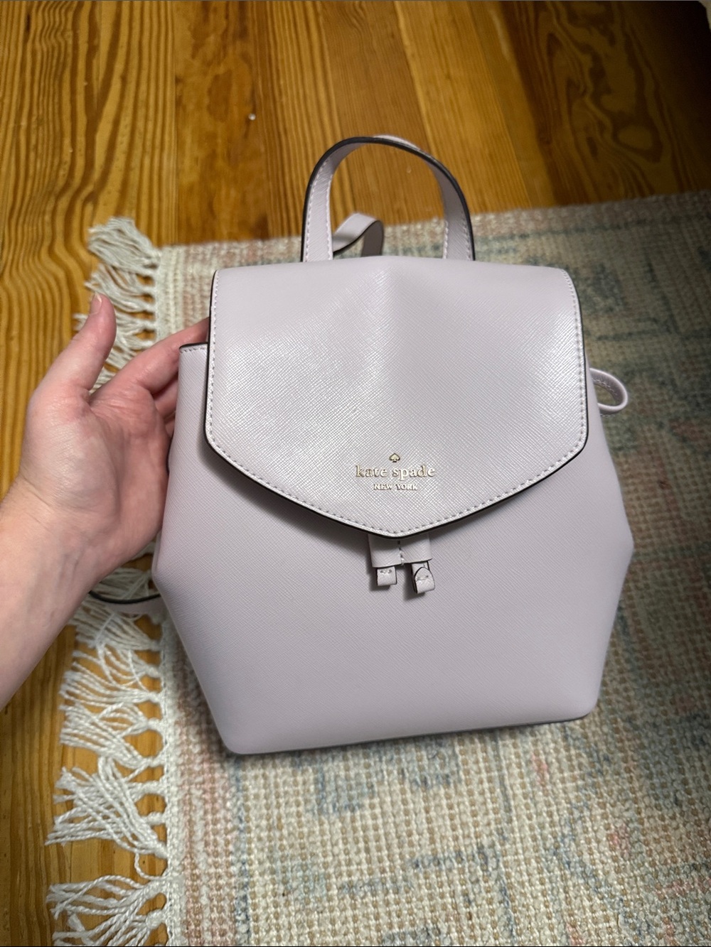 kate spade pale lavender mini backpack with gold logo